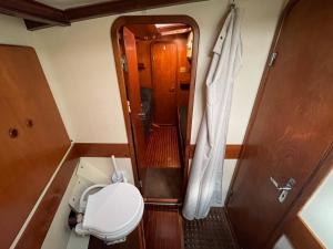 a small bathroom with a toilet in a boat at SailBoat B&B on Board in Catania +51 photos
