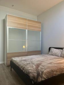 a bedroom with a bed with a large window at Zena Park in Odivelas