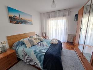 Postel nebo postele na pokoji v ubytování Piso Mónica