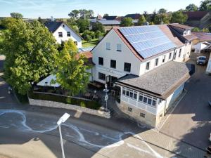an overhead view of a house with solar panels on the roof at Stempfle's Landgasthaus zum Kreuz in Unterschneidheim
