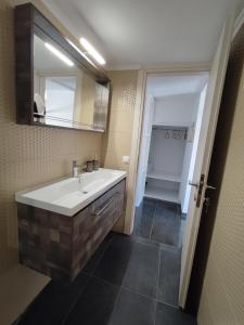 a bathroom with a sink and a mirror and a shower at THEASIS 4 luxury studio with sea view in Neos Marmaras