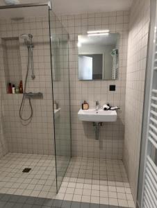 a bathroom with a shower and a sink at BeautifulParis18 in Paris