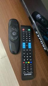 two remote controls sitting on top of a table at Blessed Condo for 6 - include net, water & electric in Manila