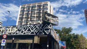 a building with a hotel sign on top of it at MY SUNNY PAYMA BEACH Apartment in Benidorm