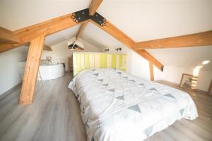 Кровать или кровати в номере Le Carport