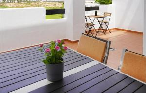 a table with a vase of flowers on it at Casa Fairview in Balsicas