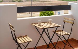 two chairs and a small table with two cups on it at Casa Fairview in Balsicas +7 photos