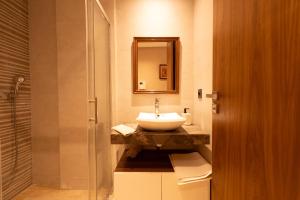 a bathroom with a sink and a mirror at Suite Apt Bourgogne N°2, 2 P in Casablanca