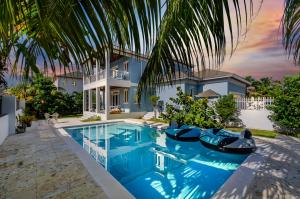 an exterior view of a house with a swimming pool at Blu Diamond Luxury Estate in Nassau