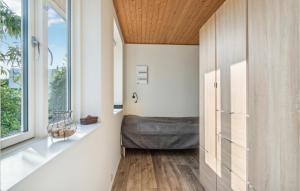 a bedroom with a bed and a window at 2 Bedroom Beautiful Home In Fllenslev in Føllenslev