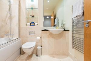 a bathroom with a toilet and a sink at Parkview, St Andrews in St. Andrews