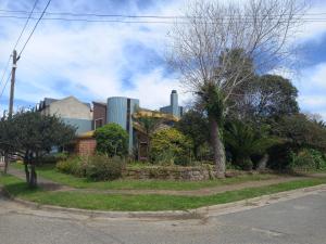 a house on the side of a street with buildings at Casas del Mar in Mar de Ajó