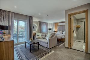 a living room with a couch and a bedroom at Locanda Museum Hotel in Giza