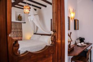 Postel nebo postele na pokoji v ubytování Quartara Boutique Hotel + 37 fotografií