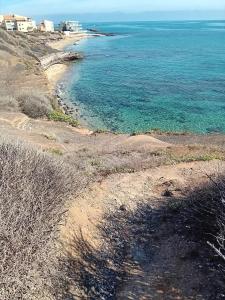 a view of the ocean from a hill at Studio Chaleureux au Cap d’Agde in Cap d'Agde