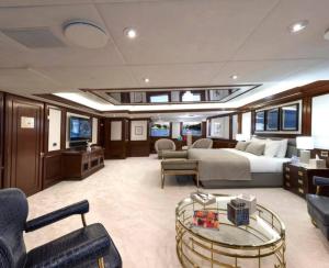 a large room with a bed and a living room on a yacht at Thai Yacht in Ban Bo Thong