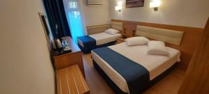 Ліжко або ліжка в номері Blue Port Hotel