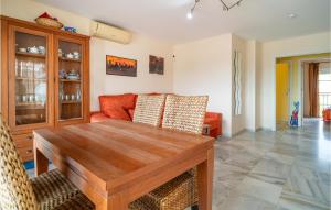 a living room with a wooden table and a couch at 2 Bedroom Gorgeous Apartment In Málaga in Málaga