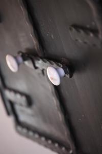 a close up of two white screws in a wallet at Katica Vendégház in Tarcal