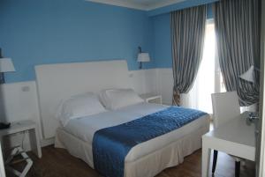 Cama o camas de una habitación en Helios Hotel