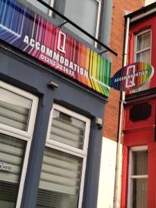 a building with a colorful sign on the side of it at Q - Accomodation in Blackpool