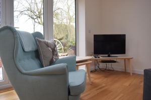 Et tv og/eller underholdning på The White House Garden Cottage