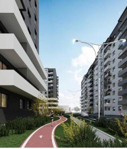 a person running on a path between two buildings at Luxury Wellness&Spa in Bucharest