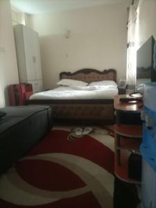 מיטה או מיטות בחדר ב-Hunnie Pie Suite Apartment