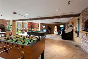 a pool table in a living room with a pool table at Cascade Village 50 Near Purgatory - Marmot Meadows Retreat in Durango Mountain Resort