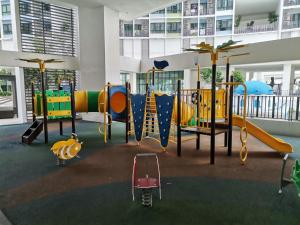 een speeltuin met een glijbaan in een gebouw bij I-Suite Block B [2r2b] # I-City [ Free Wifi + Parking ] in Shah Alam