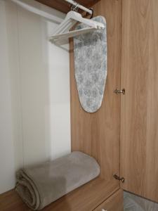 a mirror hanging on a door in a bathroom at La Lunita in Valverde