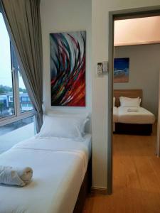 A bed or beds in a room at Husfa Mahkota Valley Studio Suite
