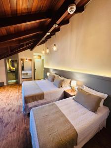 Postel nebo postele na pokoji v ubytování Hotel Pousada Kaster