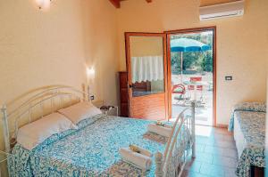 Postel nebo postele na pokoji v ubytování Agriturismo Rocce Bianche