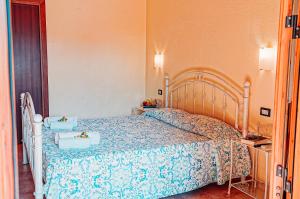 Postel nebo postele na pokoji v ubytování Agriturismo Rocce Bianche