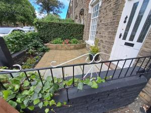 a wrought iron railing in front of a house at Maryann's in Huddersfield