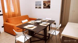 a dining room with a table and chairs at mono polis apartment in Monopoli