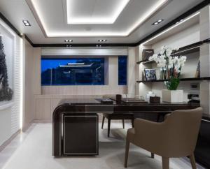 a living room with a dining room table and chairs at Luxury Yacht Travels in Tokushima