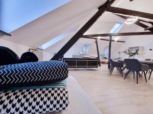 a living room with a couch and a table at Alpha Apartments in Krefeld