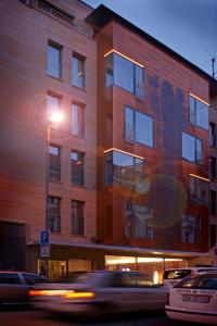 a building with a street light in front of it at Hotel Avance in Bratislava