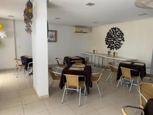 a restaurant with tables and chairs in a room at Thermas do Bandeirante in Caldas Novas