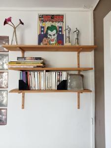 a pair of wooden shelves with books at Yaka in Saint-Paul