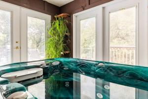 a glass counter top in a room with windows at Ponderosa Creekside Retreat in Mariposa