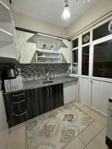 a kitchen with a sink and a counter top at Sultanahmet Yeşil Apart in Istanbul