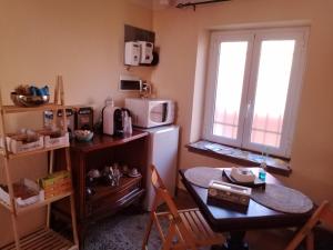 Kuchyň nebo kuchyňský kout v ubytování B&B I lupi