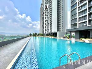a swimming pool on the roof of a building at Netizen Balcony View MRT 4-5pax #17 in Cheras