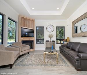 a living room with a couch and a table at Three Bedroom River Access in Redding