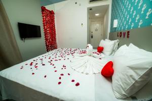 Cama ou camas em um quarto em Nobile Inn Pampulha