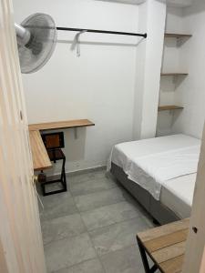 מיטה או מיטות בחדר ב-Casa Lopez Bucaramanga