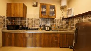 Kuchyň nebo kuchyňský kout v ubytování Walisons Homestay Abelia